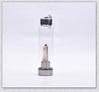A handcrafted glass water bottle infused with natural crystals, offering a unique and sustainable hydration experience.