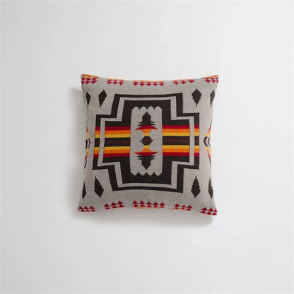 Geometric-patterned cushion cover made of soft, breathable 100% cotton