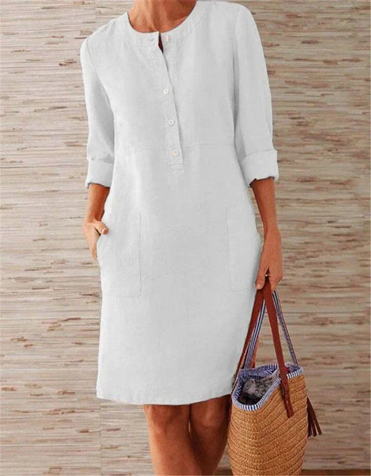 Flowy cotton and linen dress with vintage-inspired silhouette and button detailing, perfect for comfortable summer wear in the United Kingdom