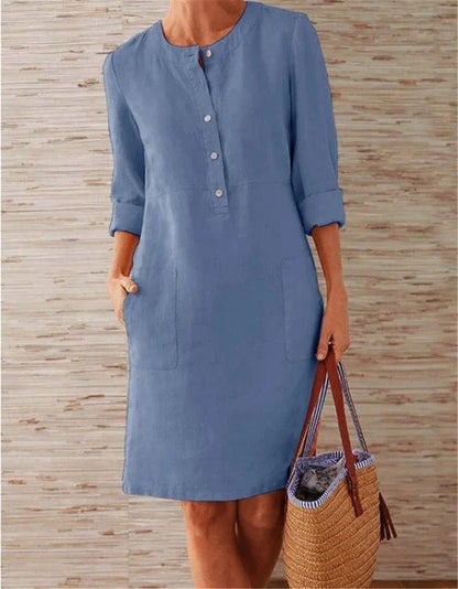 Flowy cotton and linen dress with vintage-inspired silhouette and button detailing, perfect for comfortable summer wear in the United Kingdom