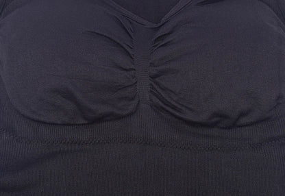 A close-up image of a black compression vest with a built-in bra, designed to sculpt and support the figure.