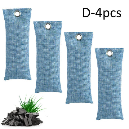 Set of black, green, grey, and blue rectangular bamboo charcoal deodorising bags on a white surface.