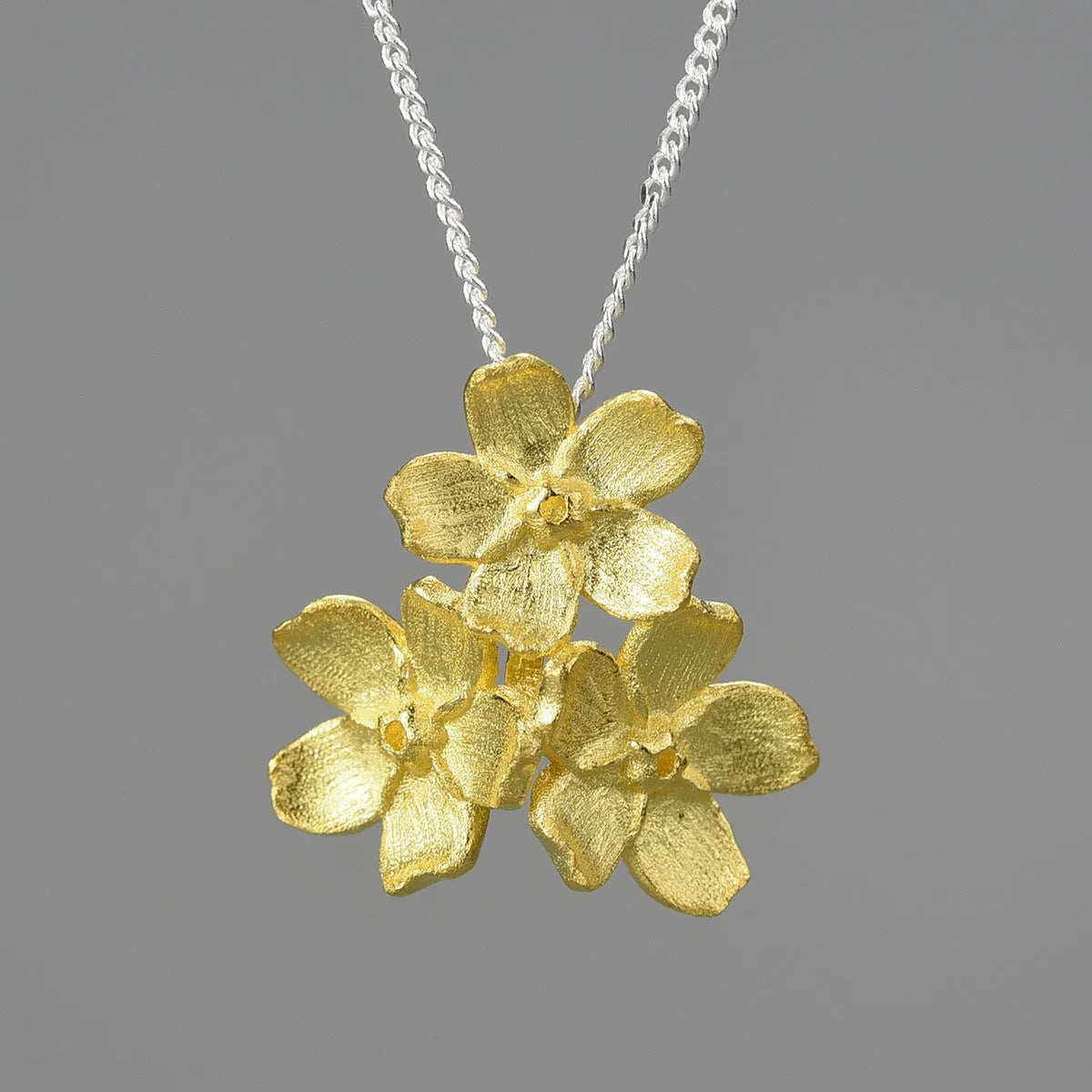 Myosotis Sylvatica sterling silver floral pendant with open mouth design in pastoral style