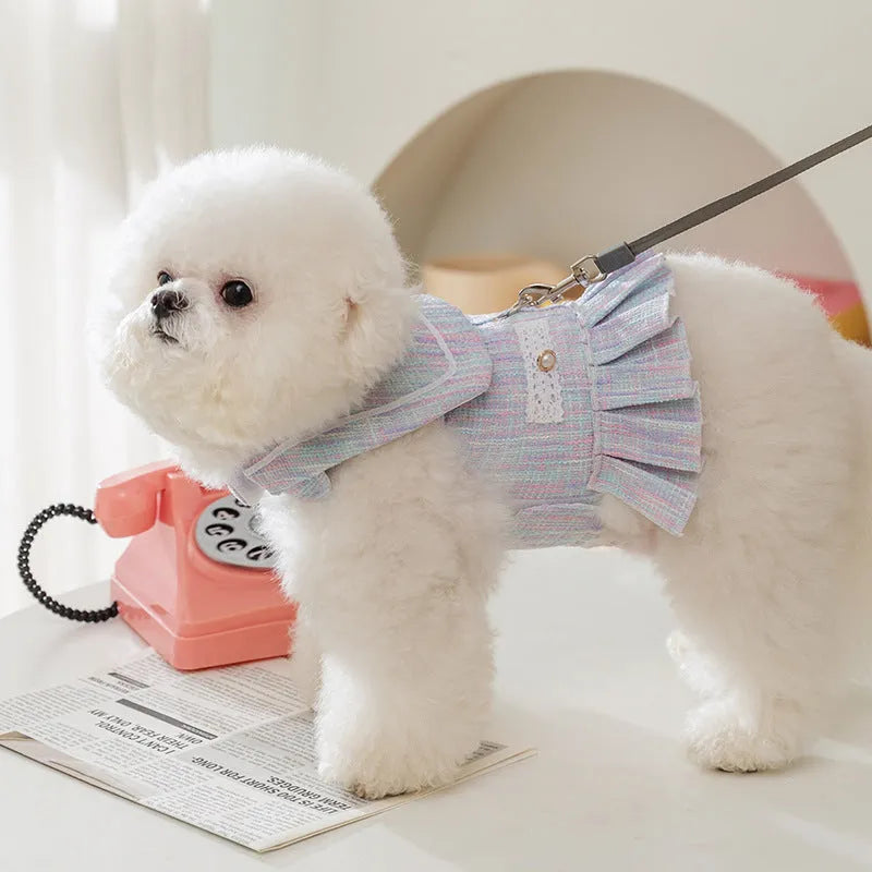 Purple and pink polyester pet clothing for a cat or small dog on a white background.