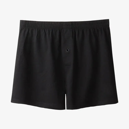 Men's light grey cotton boxer shorts with a loose fit and high waist on a plain background.