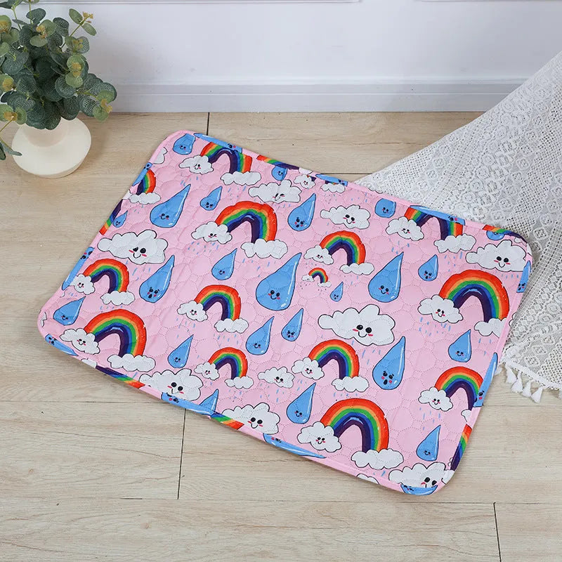 Reusable washable pet urine pad showing colourful animal pattern and waterproof backing.