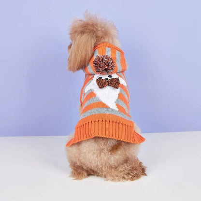 Orange knitted pet sweater with striped fur ball decoration and hood for small dog or cat.