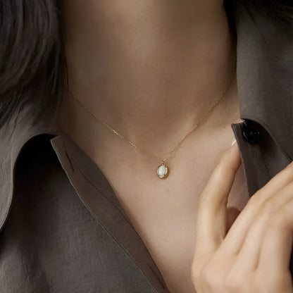 S925 sterling silver oval pendant necklace with jelly opal style, available in gold or white gold plating.