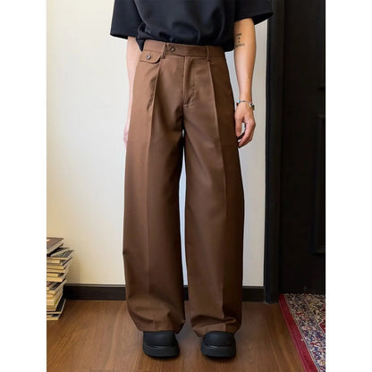 Man wearing straight-leg wide-leg casual trousers in brown, showcasing the relaxed drape and fit.