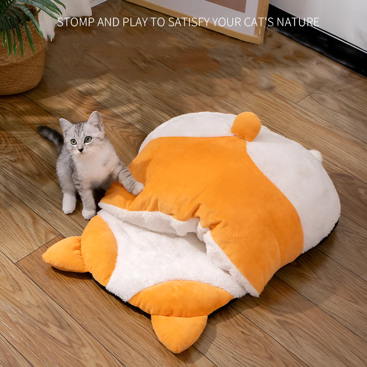 Orange fleece interior of a semi-closed cat sleeping bag measuring 65cm by 53cm.