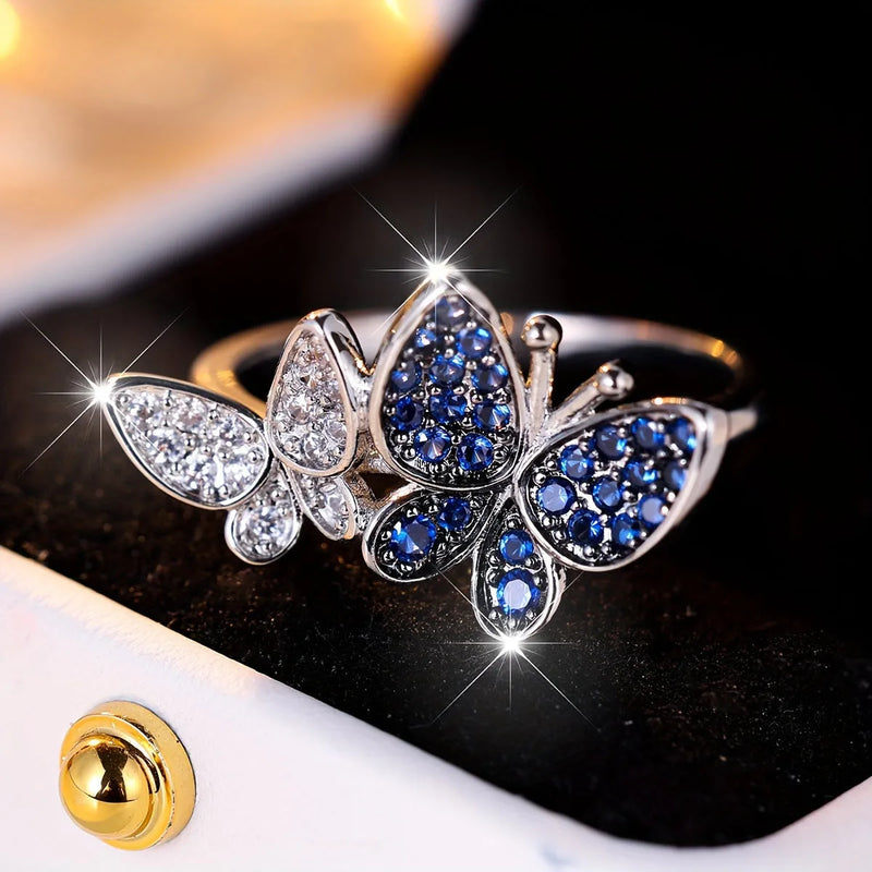 Butterfly ring for women in blue and white electroplated copper with adjustable sizing options including sizes 6, 7, 8, 9, and 10 for a delicate feminine jewellery piece