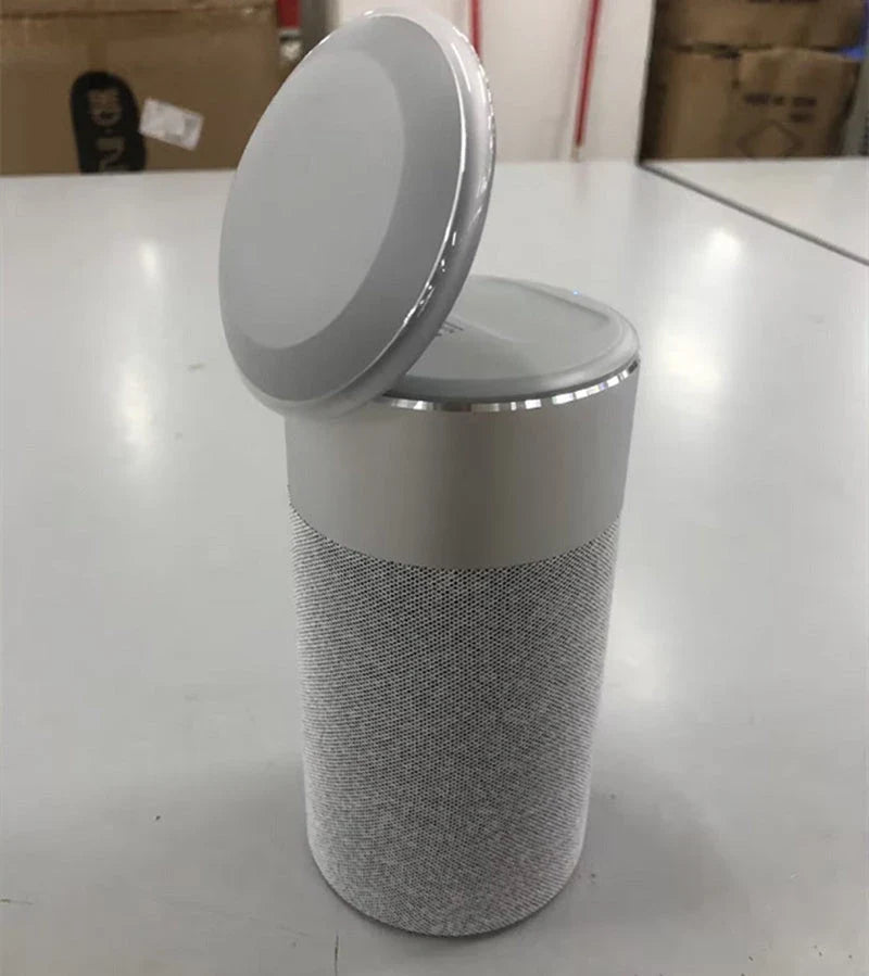 A 3-in-1 device that wirelessly charges iPhones and AirPods, plays Bluetooth audio, and has a touch-sensitive lamp