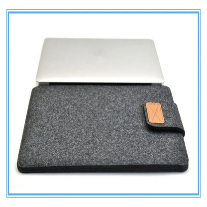 Dark grey clamshell laptop bag open to show plush internal liner and corner protectors.