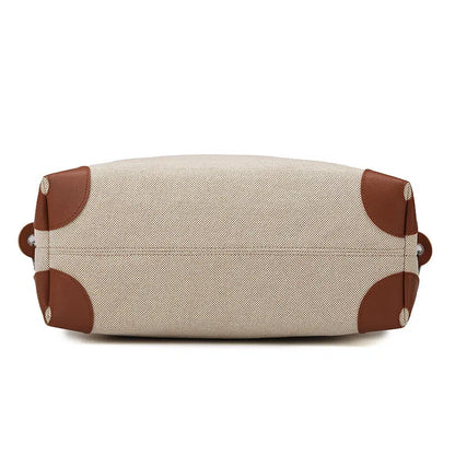 Large capacity canvas yoga and fitness bag in brown, khaki, or black with polyester lining and shoulder strap.