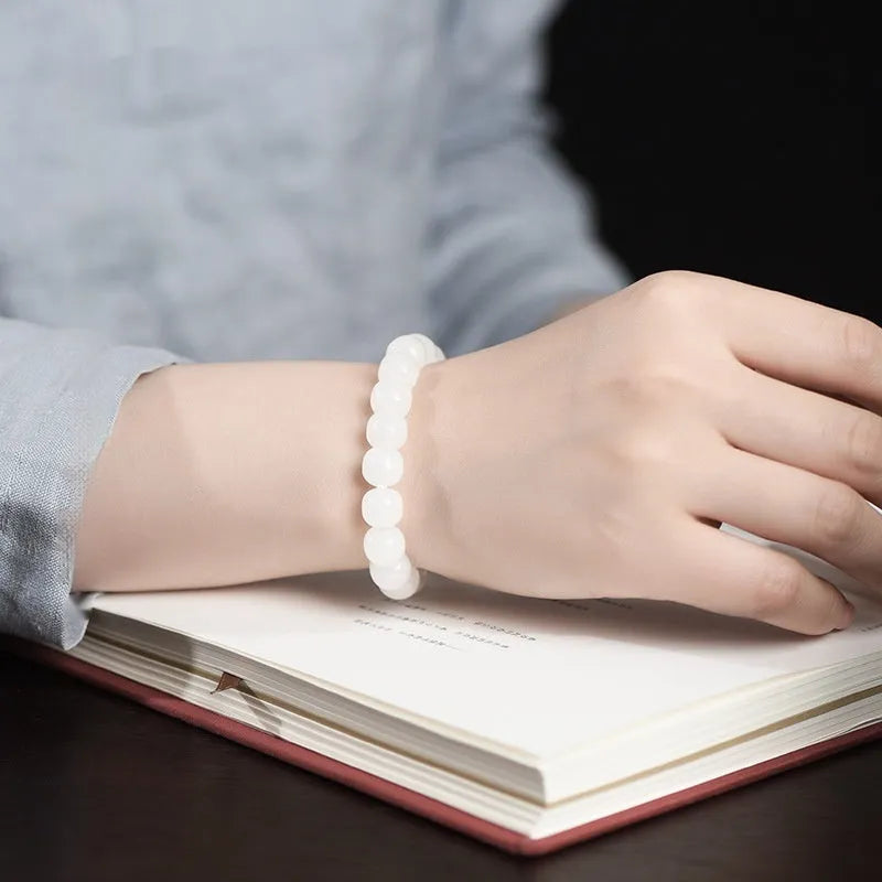 White jade barrel beads bracelet with Hetian jade beads in 5x6mm, 7x8mm, or 8x10mm sizes on a wrist