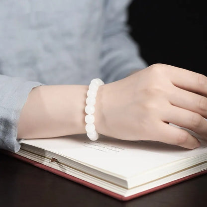 White jade barrel beads bracelet with Hetian jade beads in 5x6mm, 7x8mm, or 8x10mm sizes on a wrist