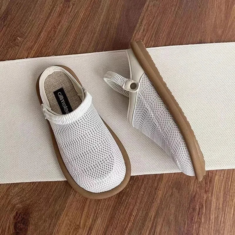 Breathable linen slip-on hole shoes in milky white colour with mesh lining and rubber sole.