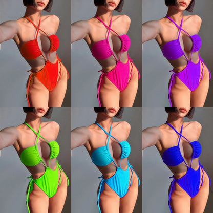 Women's black one-piece drawstring swimsuit in a briefs style on a mannequin.