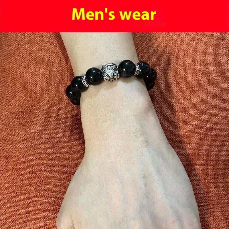 Obsidian stone bracelet featuring Silver 999 jewellery with natural obsidian beads available in two unisex sizes, 10mm for women and 12mm for men, in a simple travel gift style for commemoration.