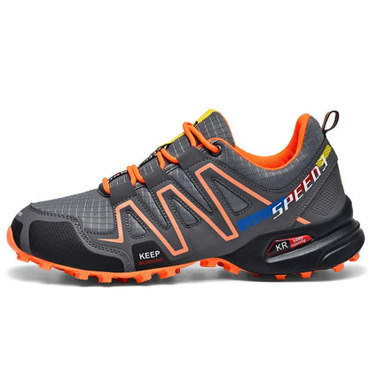 Men's low-top casual shoe in grey orange with synthetic leather upper and mesh lining.