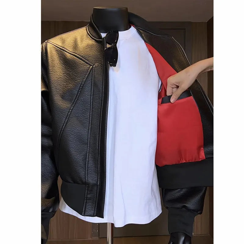 Man wearing a long black PU leather jacket with a litchi grain texture, showing its extended 100cm length and tight fit.