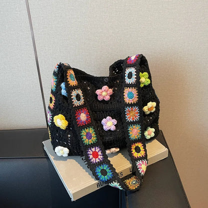 Women's large white knitted shoulder bag with hollow weave pattern and single strap.