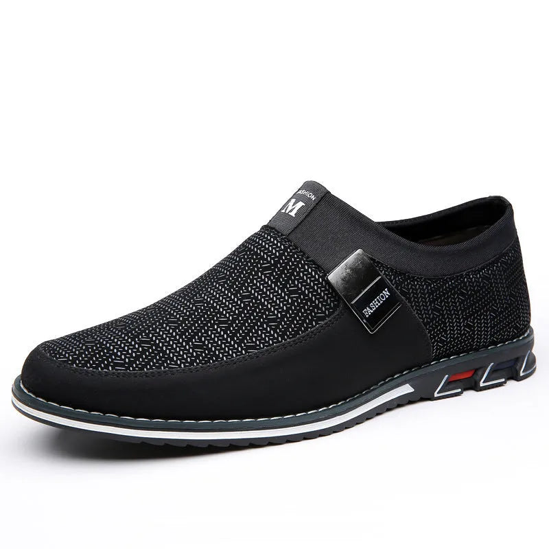 Men's grey and white synthetic leather slip-on casual shoes with a square toe and flat rubber sole.