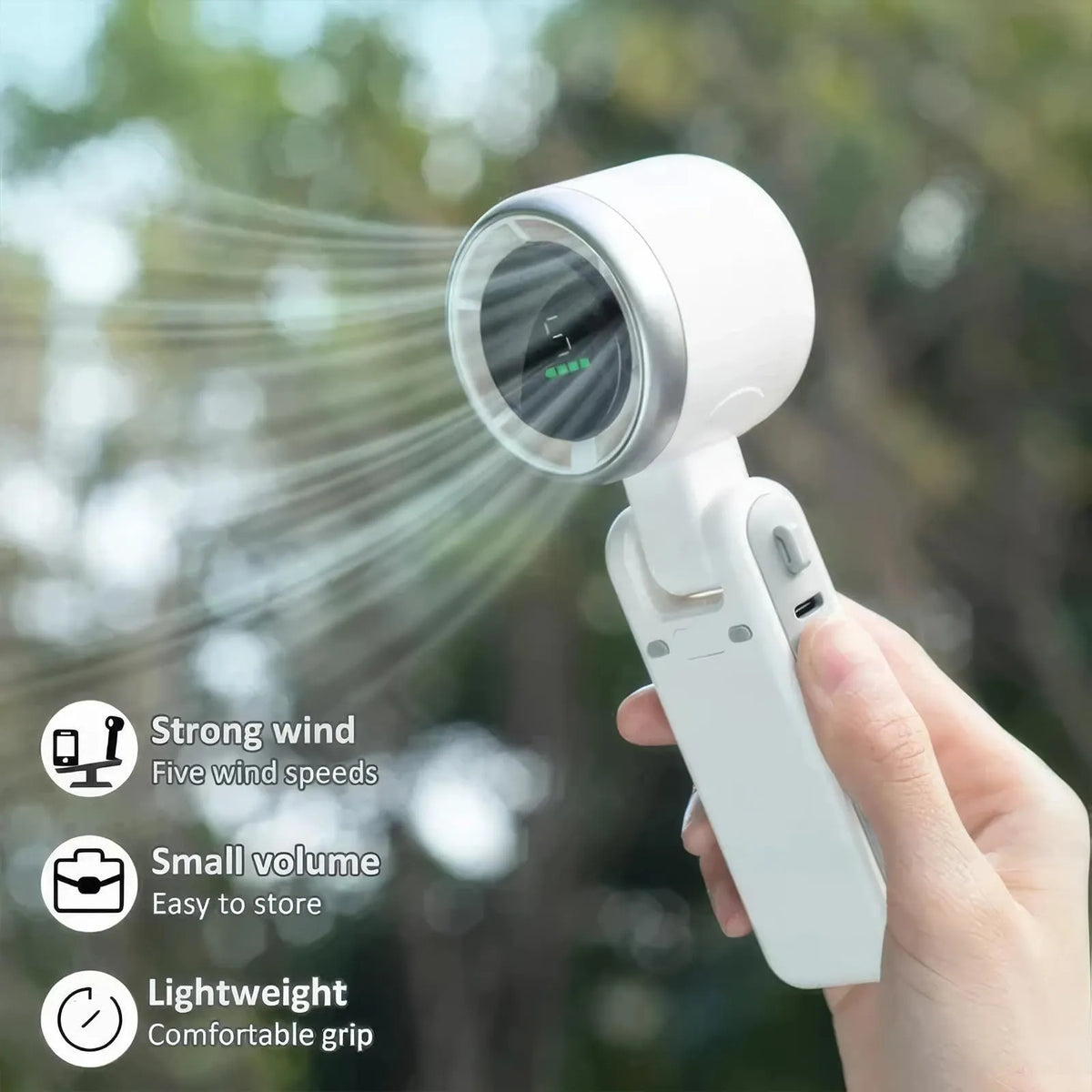 Portable folding mini fan showing adjustable head and compact plastic housing with USB Type-C charging port