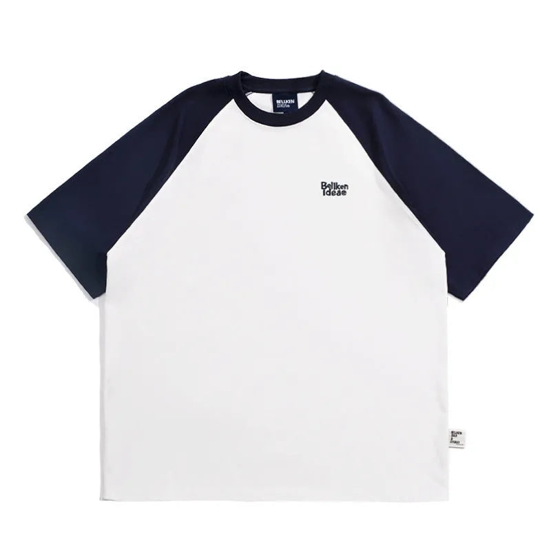 Men's blue loose-fit Japanese style long sleeve t-shirt with raglan sleeves on a hanger.