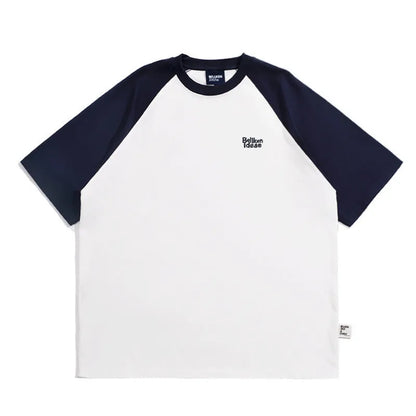 Men's blue loose-fit Japanese style long sleeve t-shirt with raglan sleeves on a hanger.