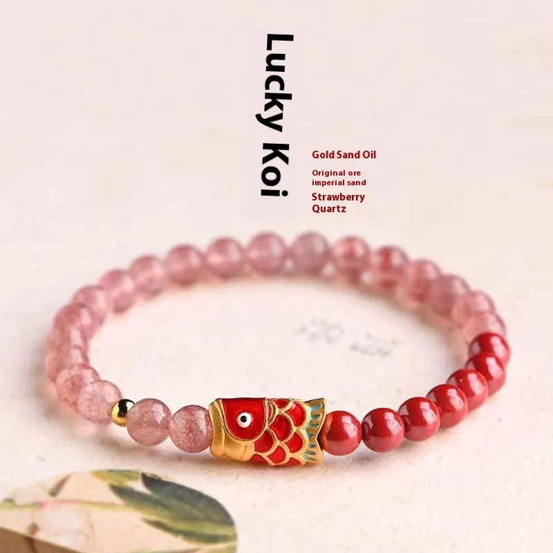 Purple cinnabar and strawberry quartz bracelet with peach blossom and koi beads measuring 19 cm