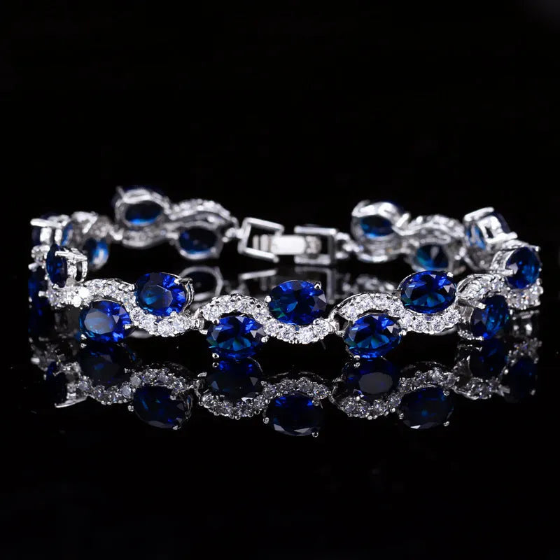 Copper-plated gold bracelet with AAA+ zircon stones in simple geometry style measuring 18.4cm length