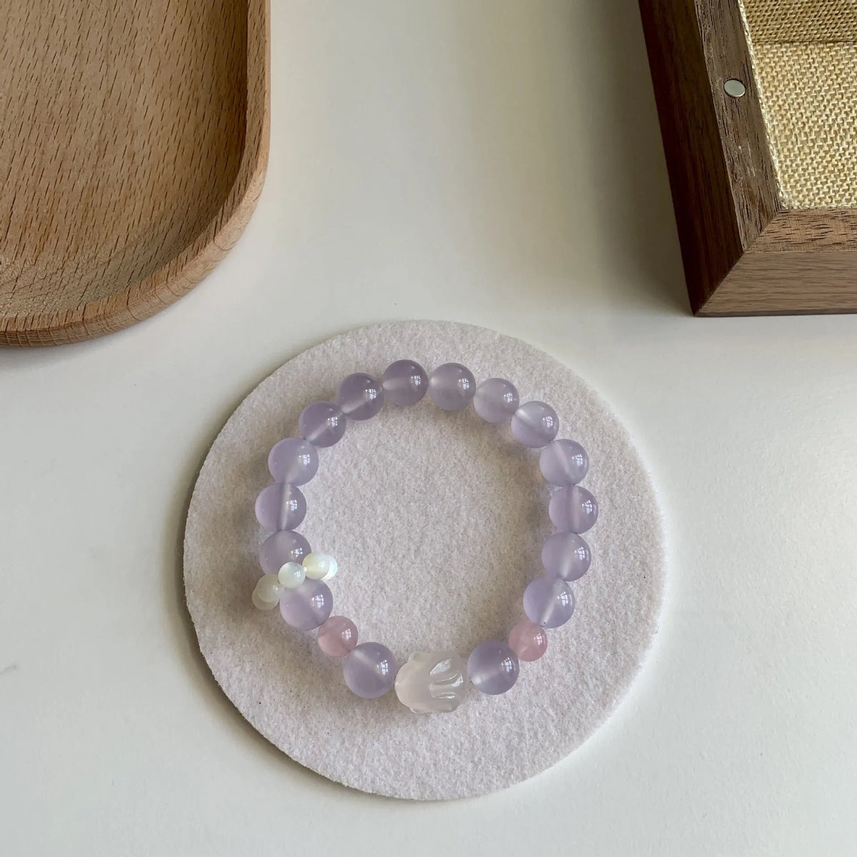 Handmade women's bracelet with a glass rabbit charm on a coloured glaze chain.