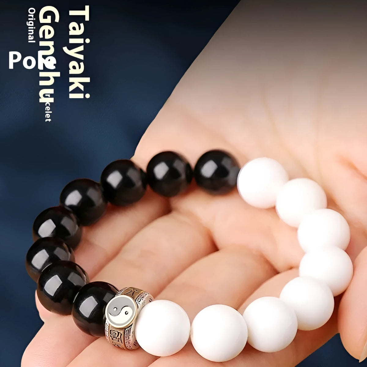 Black and white Tai Chi bracelet with obsidian beads and six-word mantra in geometric pattern