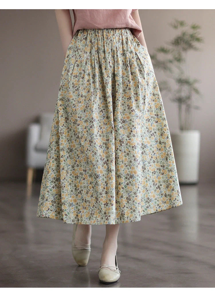 Elegant floral-printed cotton skirt with pleated design, available in yellow and blue flower patterns