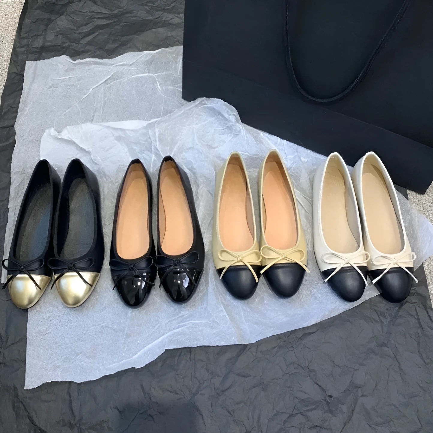 Apricot flat ballet shoes with a bowknot, round toe, and soft rubber sole.