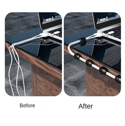 Silicone cable organiser clips in various colours, used to neatly hold and manage cables on desks, tables, and other surfaces