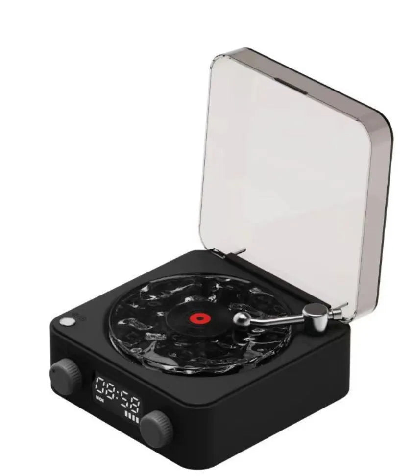 Retro-style turntable Bluetooth speaker with glowing RGB light projection on a wooden surface.