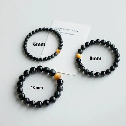Black obsidian stone bracelet with geometric beads in unisex Korean style.