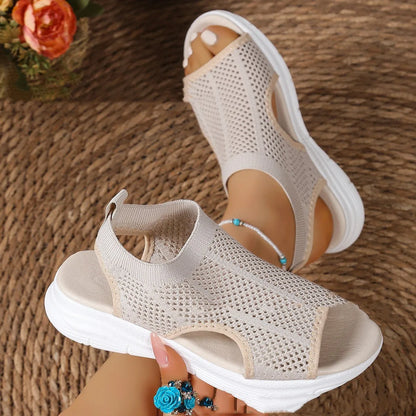 Women's black platform sports sandals with a flat toe and rubber sole on a light background
