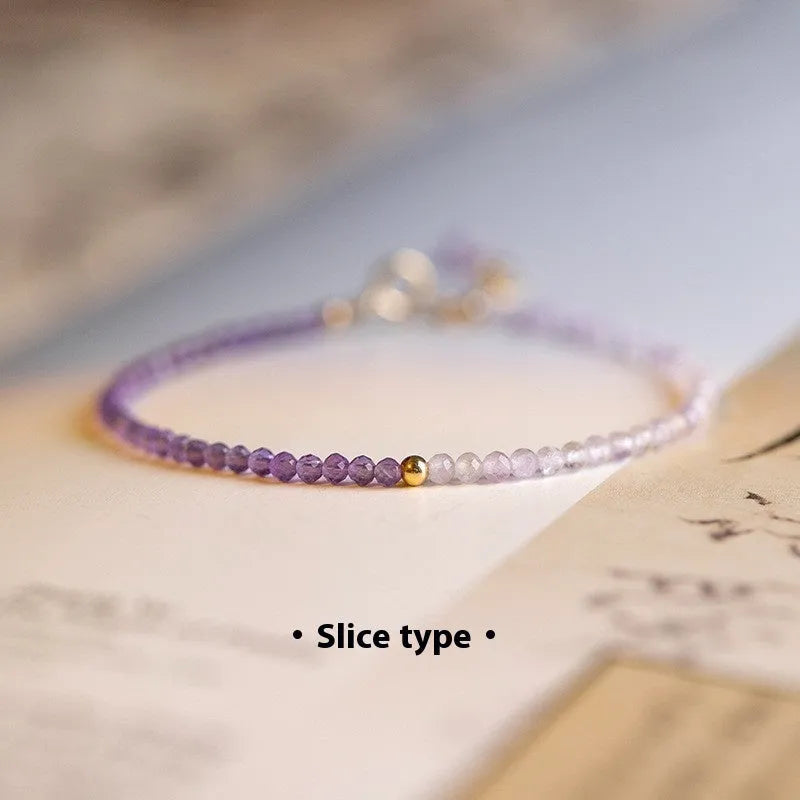 Women's geometric crystal bracelet with cut facets and spherical sections in 2mm purple rattan style.