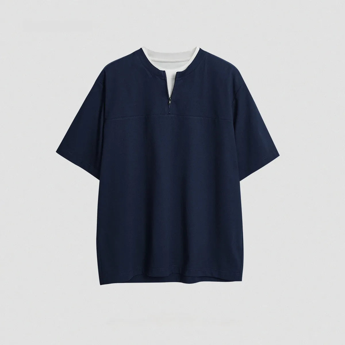 Solid colour loose fit cotton blend pullover top with patchwork collage detailing on a model.