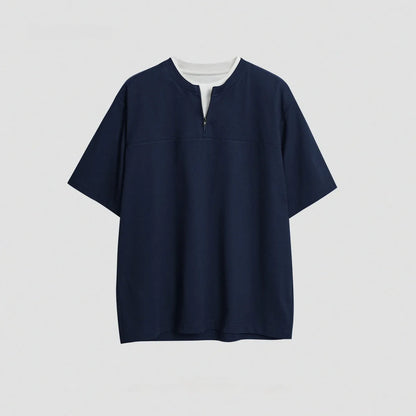 Solid colour loose fit cotton blend pullover top with patchwork collage detailing on a model.
