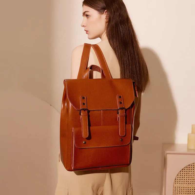 Genuine cowhide leather women's computer backpack in black, shown from a front perspective.