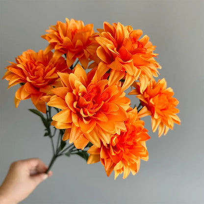 Desktop fan-shaped display holding artificial silk flowers in rose and peony varieties with colourful petals