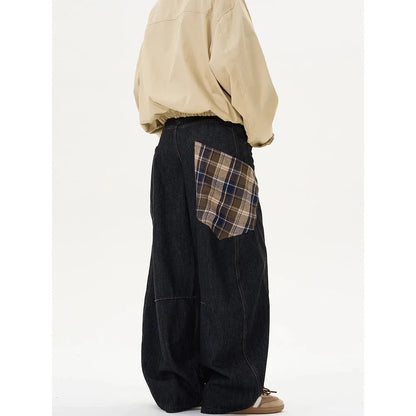 Loose straight-leg cotton trousers in a red plaid pattern, laid flat.