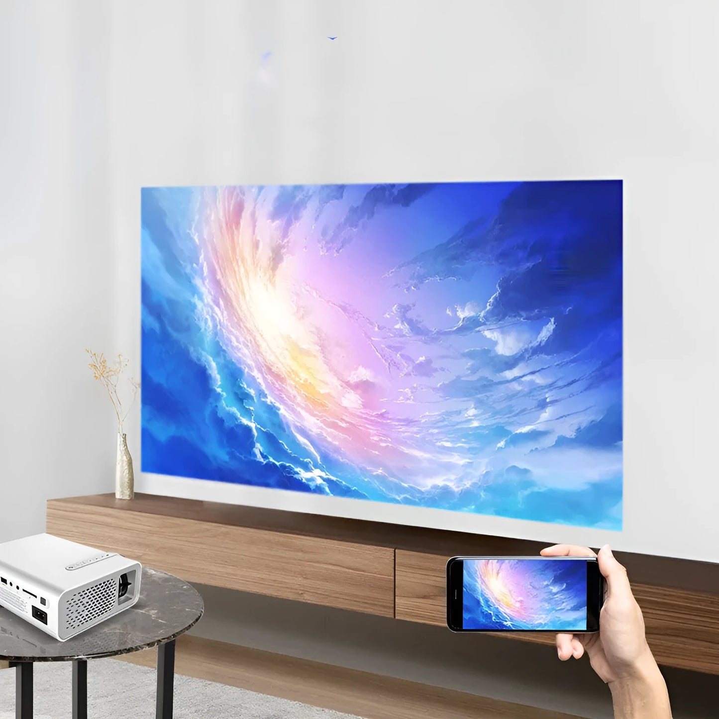 Black or white YG530 mini mobile phone projector on a table, projecting a wireless image.