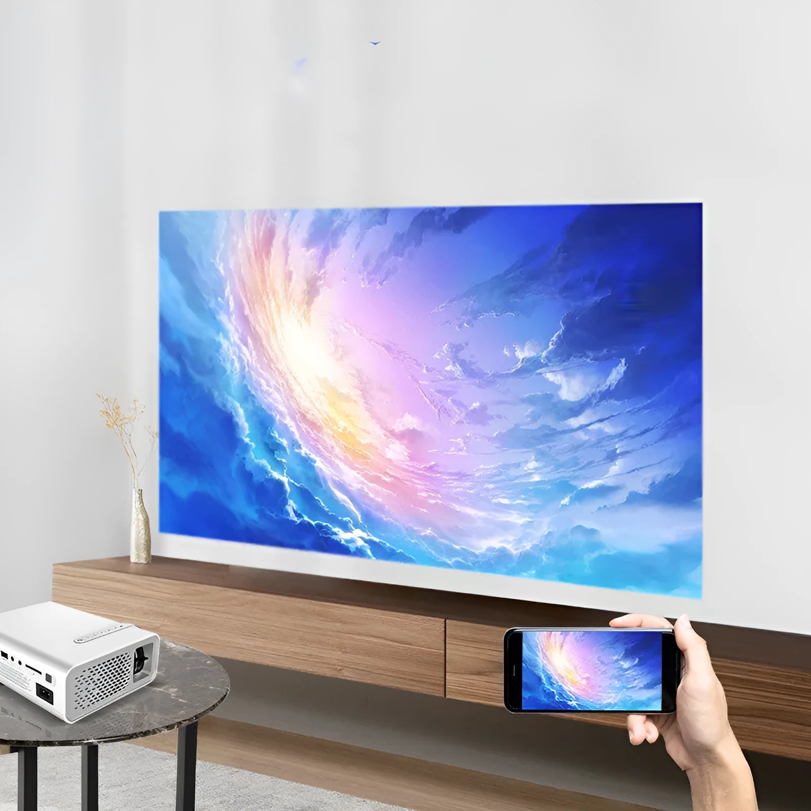 Black or white YG530 mini mobile phone projector on a table, projecting a wireless image.
