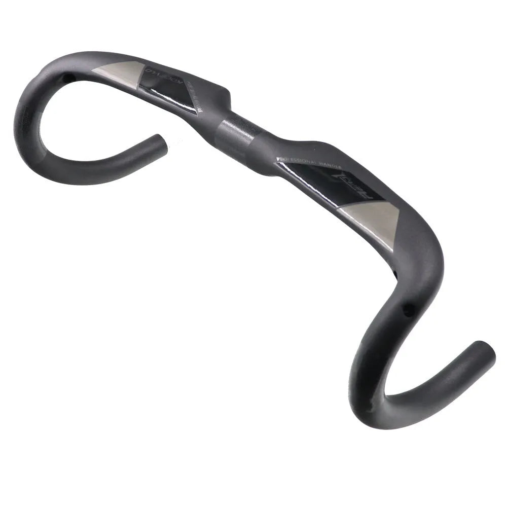 Matt carbon fibre road bike drop handlebar showing bent shape and clamp area.