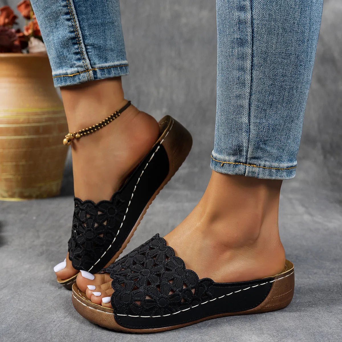 Women's wedge beach slippers with flower cutout design on PVC upper, shown in light brown colour.